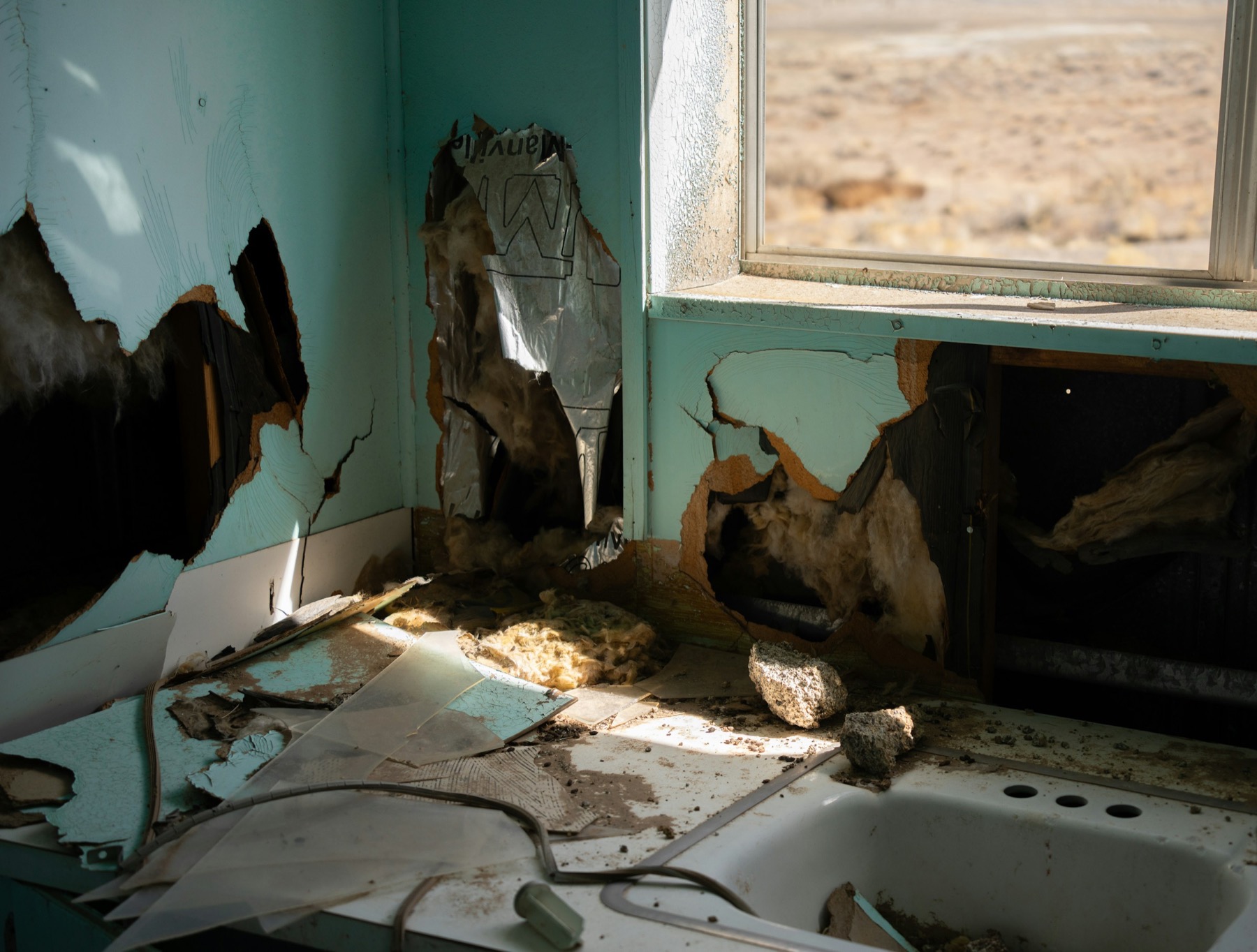 Water cleanup and drying equipment inside a damaged room